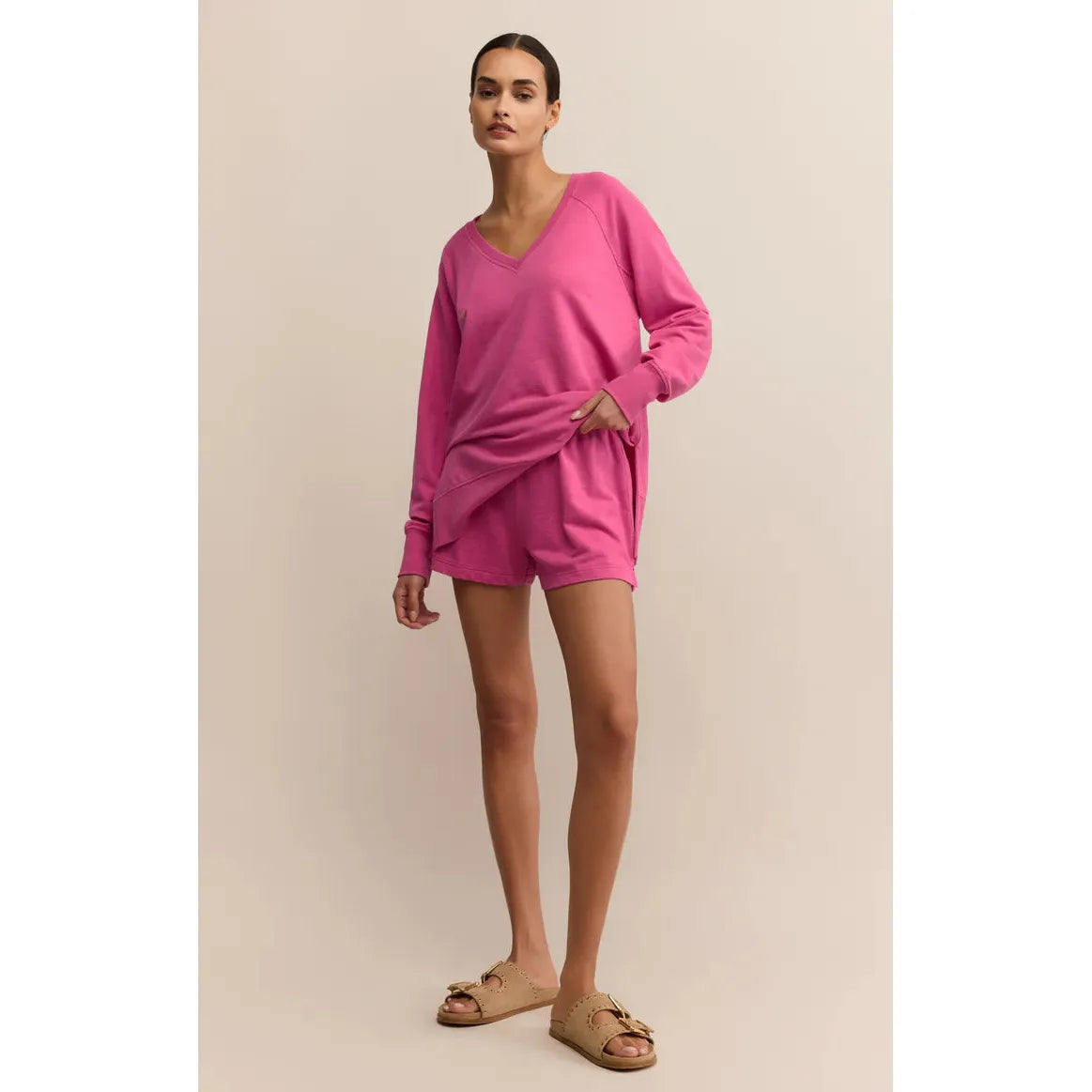 Z Supply pink oversized V-neck Weekender top with long sleeves on model, paired with shorts in Baby French Terry knit.