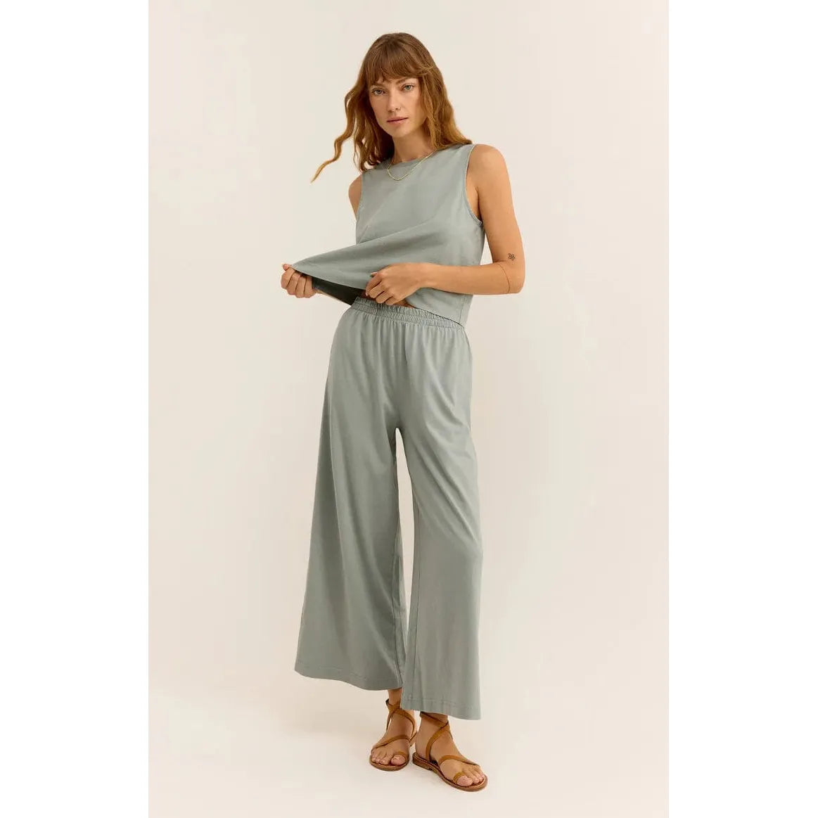 Stylish model showcasing the Z Supply Sloane Muscle Jersey Tank, perfect for a relaxed, everyday look.