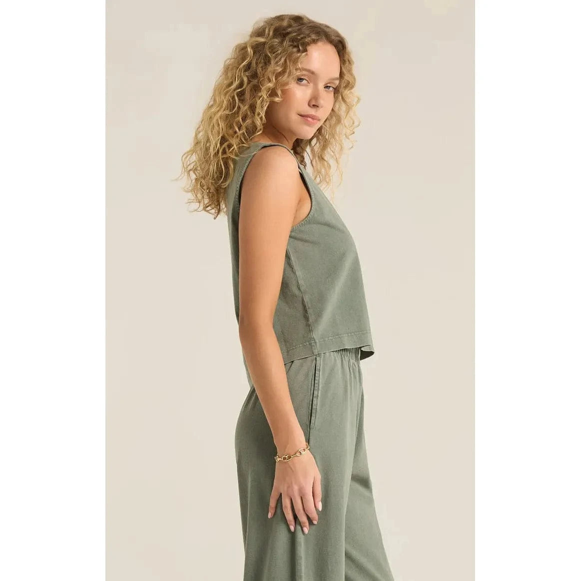 Stylish model showcases the Z Supply Sloane V-Neck Tank - Sale, featuring a relaxed fit and lightweight fabric.