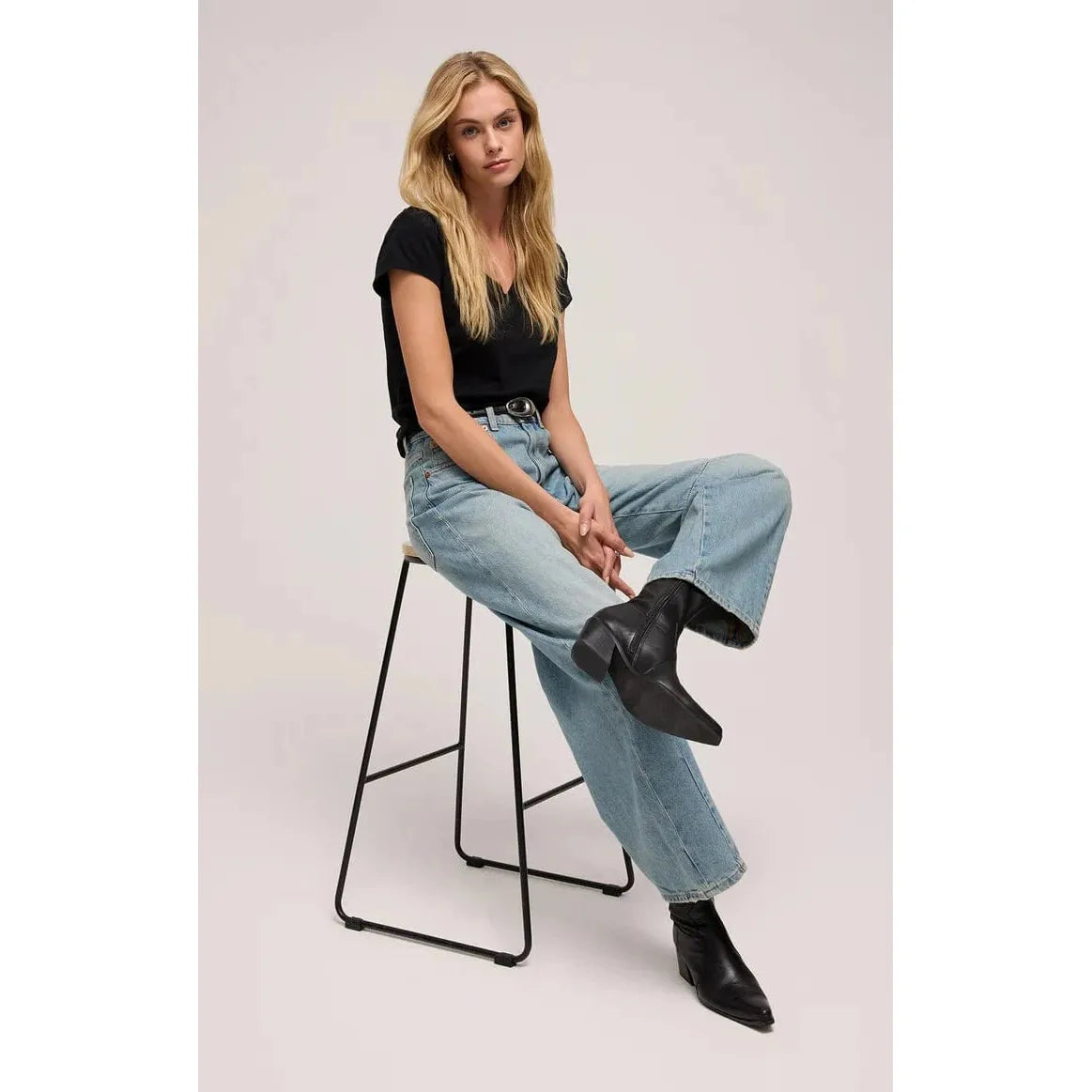 Stylishly wearing the Z Supply Modern Jersey V-Neck Tee, perfect for casual outings and breathable comfort.