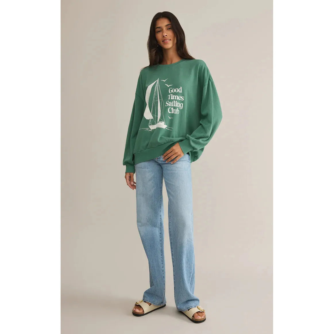 Cozy and stylish, the Z Supply Sail Away Sunday Sweat Shirt features a chic sailboat print in botanical green.