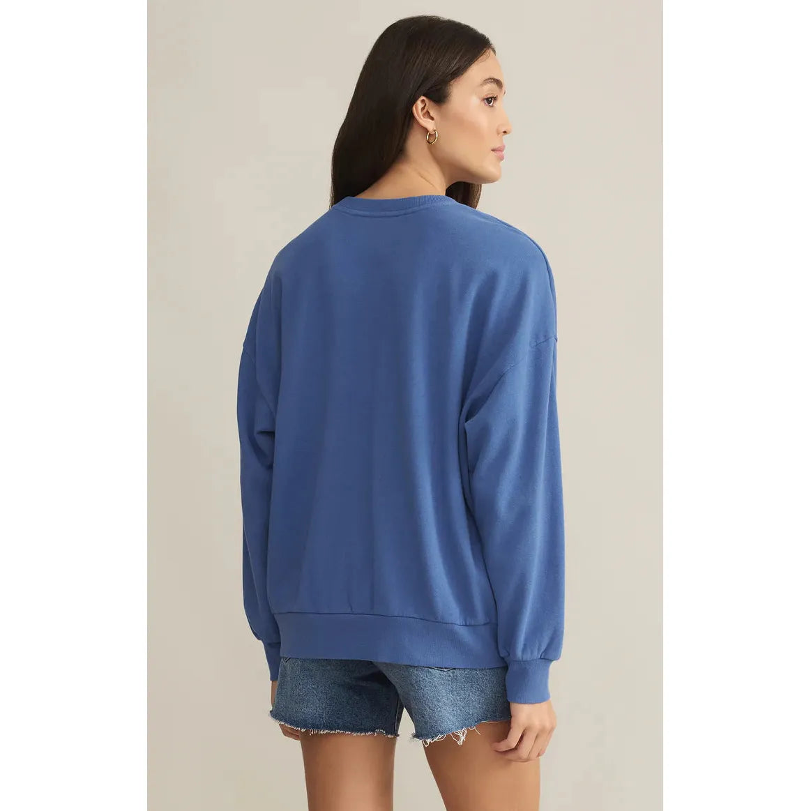 Luxuriously oversized Z Supply Vacay Sunday Sweat Shirt in blue, perfect for sunny-day comfort with a stylish graphic.