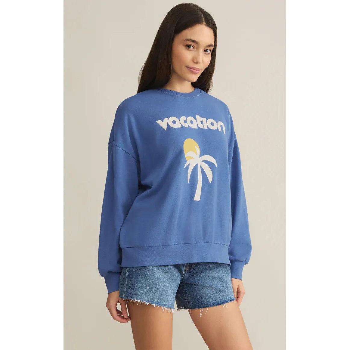 Elevate your casual look with the Z Supply Vacay Sunday Sweat Shirt featuring a fun "Vacation" graphic.
