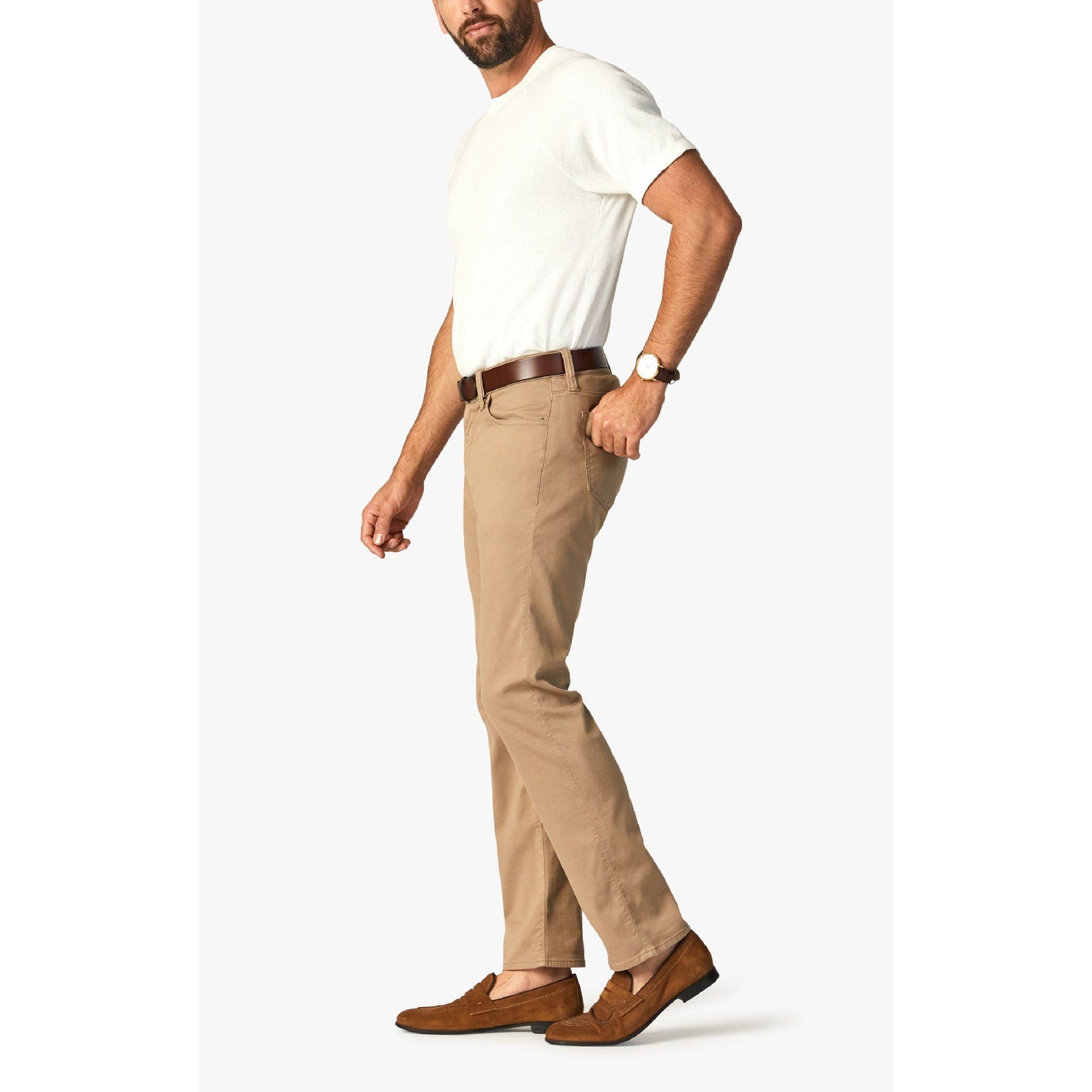 34 Heritage Courage Khaki Summer CoolMax Pants worn by a man in khaki chinos with brown belt and tan loafers