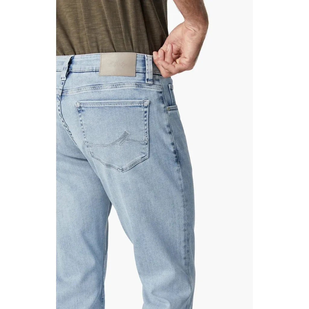 Bleached Urban Courage straight-leg jeans, back view with beige leather waistband patch.