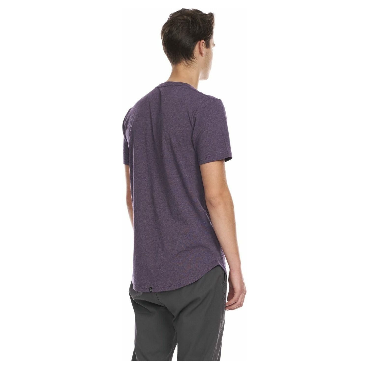 Kuwalla Scoop Tee purple on model, back view; scooped hem, lightweight comfort, branded label.
