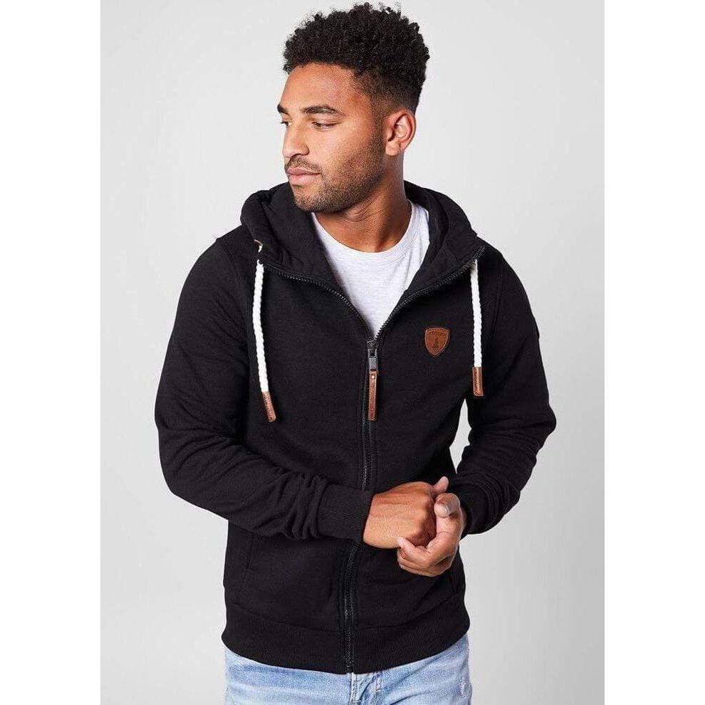 Model wearing Wanakome Zeus Hoodie: black full-zip hoodie with white rope drawstrings and faux leather accents.